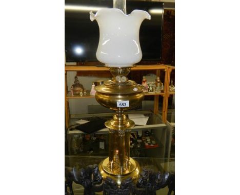 A brass oil lamp supported by 4 Corinthian columns.