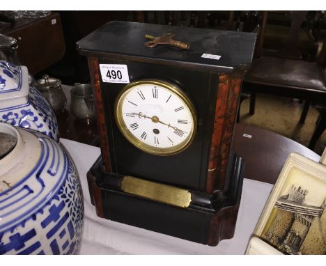 A black slate clock in working order.