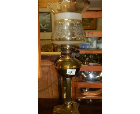 A brass oil lamp.