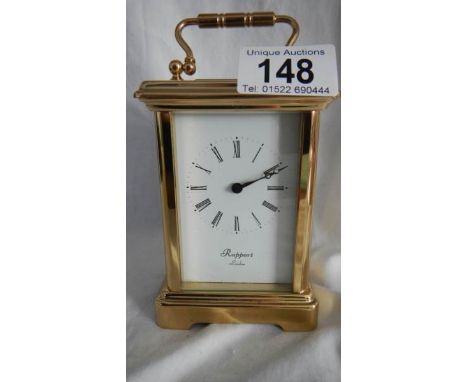 A good 20th century brass carriage clock with open glass top and sides by Rapport, London, in working order.