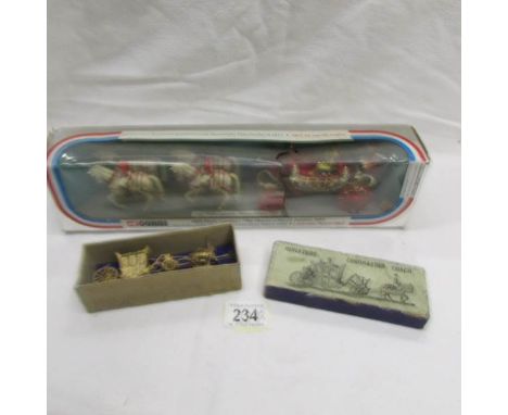 A boxed Corgi coronation coach (box a/f) and a miniature coronation coach.