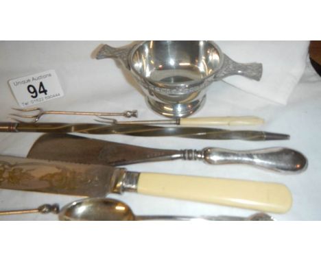 12 items of silver plate including wine ladle.