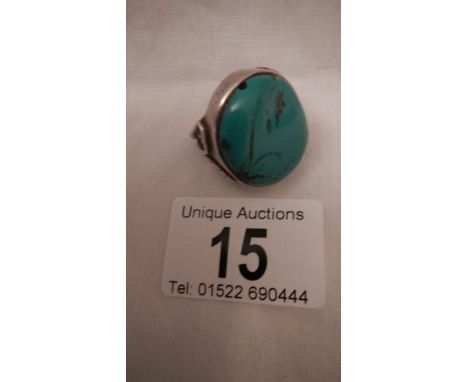 An old silver ring set turquoise, size M, in good condition.