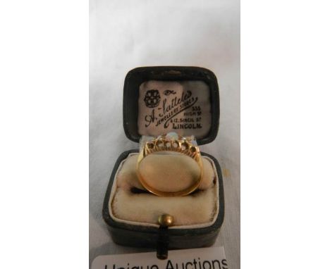 An 18ct gold ring set opals.