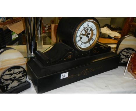 A black mantel clock and a pair of clock side pieces.