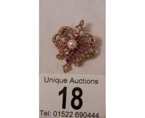 A good old 9ct gold ruby and pearl brooch.