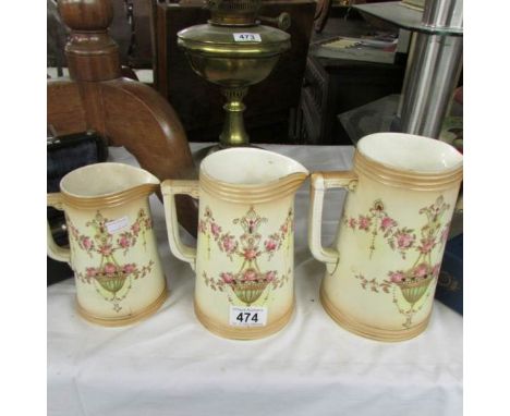 A set of 3 Crown Devon graduated jugs.