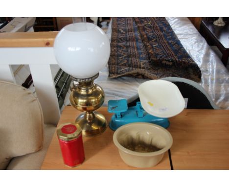 A set of kitchen scales and weights, jelly mould, brass oil lamp with milk glass shade 
