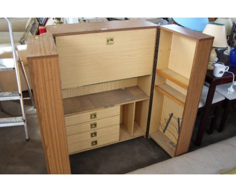 A two door cabinet fitted four drawers