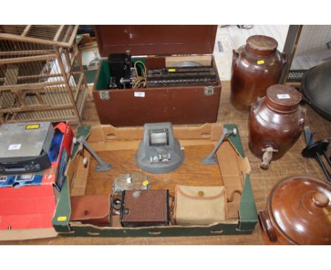 A vintage Kodak projector; together with a box containing cameras and splicer