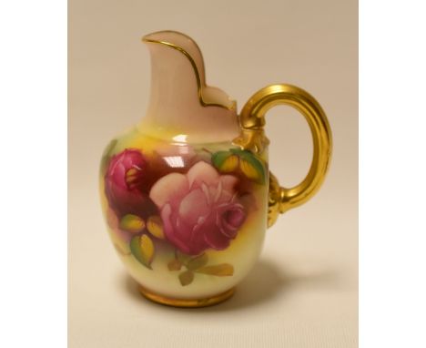 A SMALL ROYAL WORCESTER JUG with gilded handle and upright spout, painted with roses by Millie Hunt, signed, date mark for 19