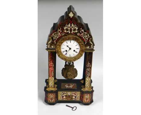 A FRENCH TORTOISE SHELL & ORMOLU MANTEL CLOCK of architectural form with  white enamel dial bearing Roman numerals over a dec