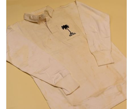 A FIJI INTERNATIONAL RUGBY UNION SQUAD JERSEY, bearing crest to panel and stitched No.24, 'Presented by S Toga - Captain of F