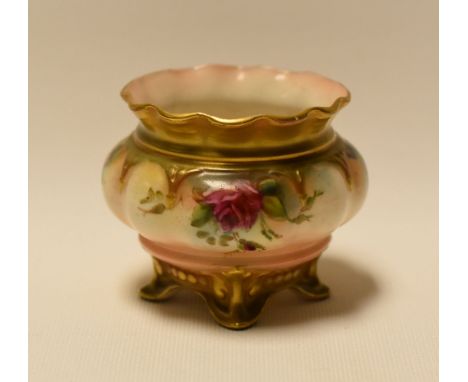 A ROYAL WORCESTER MINIATURE PLANTER on four feet, with crimped neck and painted with flowers, dated 1909, 6cms diam