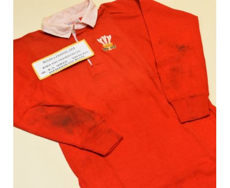 A WALES INTERNATIONAL RUGBY UNION JERSEY 'WORN & PRESENTED BY W.D MORRIS, V FRANCE 1974', bearing stitched crest and No.6 to 