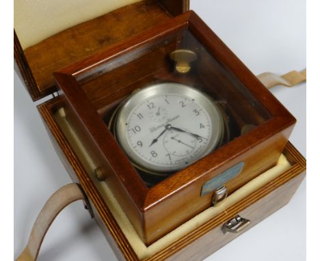A THOMAS MERCER LTD NAUTICAL CHRONOMETER No.28343 bearing Arabic numerals to the silvered dial and with two subsidiary dials,