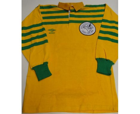 A SPORT AID INTERNATIONAL SEVENS jersey in yellow with green, the reverse bearing No.7 to a stitched panel and with Umbro lab