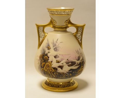 A ROYAL WORCESTER TWIN HANDLED VASE DECORATED WITH SWANS believed by Charles Baldwyn, the eight swans in flight amongst wetla