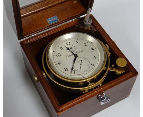 A THOMAS MERCER LTD NAUTICAL CHRONOMETER No.27035 bearing Roman numerals to the silvered dial and with two subsidiary dials, 