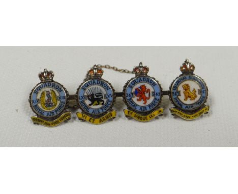 AN ENAMEL & WHITE GOLD RAF BROOCH composed of four circular squadron coat-of-arms with titles, Latin mottos and crown finials