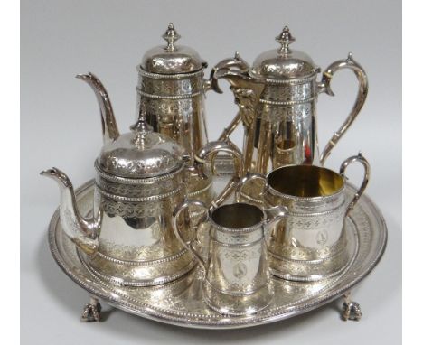 A FINE QUALITY EPNS COFFEE & TEA SERVICE including footed circular tray, each element with elegant engraving and crests to th