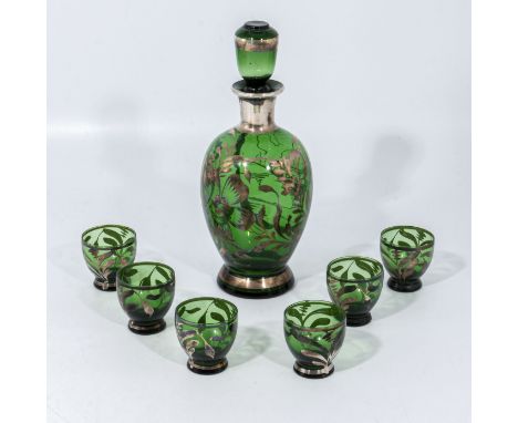 A gilt and green glass decanter and six glasses