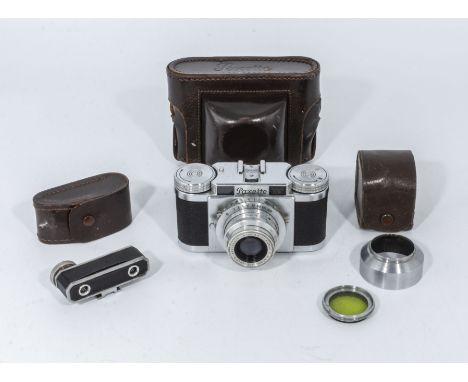 A Paxette camera in leather case together with a range finder and a lens hood