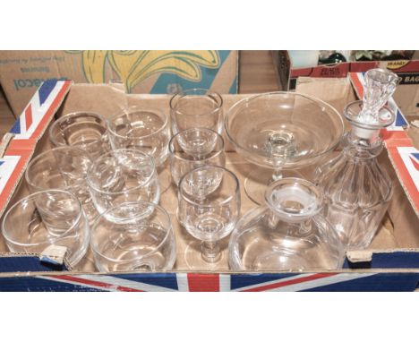 A box containing wine glasses, a decanter and other glass pieces