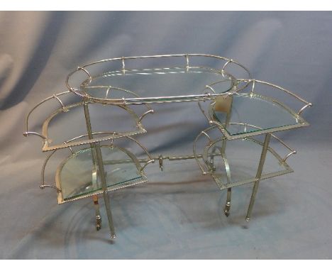 A 20th Century chrome and glass folding drinks trolley raised on castors (missing one glass shelf)