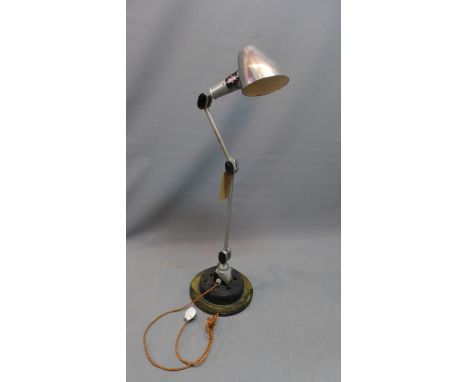 A vintage E.D. L. industrial angle poise lamp raised on cast iron base