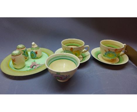 A collection of Clarice Cliff to include a Lynton shape cruet set comprising a mustard pot, salt and pepper pots also various