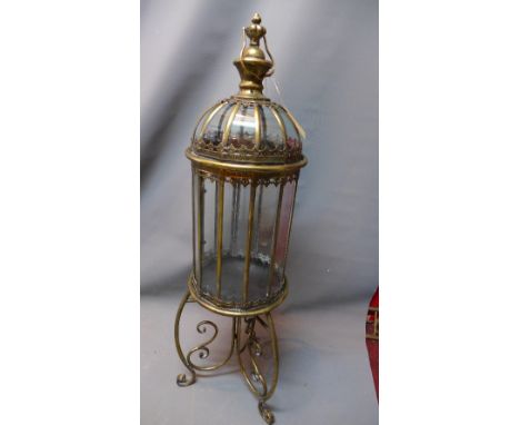 A gilt metal storm lantern on stand. 
