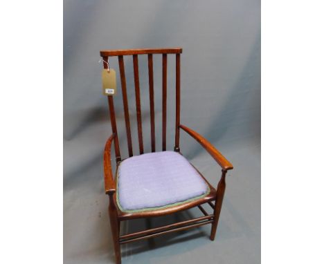 An early 20th Century oak stick back arm chair bearing label for Ernest Smith. 