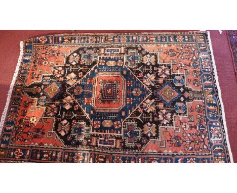 A fine Northwest Persian Nahawand rug, central diamond medallion with repeating geometrical motifs within stylised jade flora