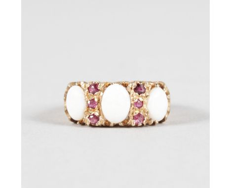 AN OPAL AND RUBY 9CT YELLOW GOLD DRESS RING.