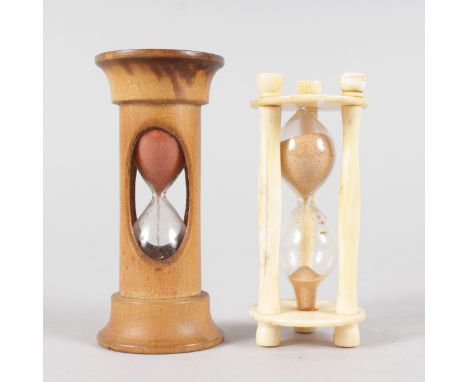 A SMALL TREEN EGG TIMER and ANOTHER IN BONE.