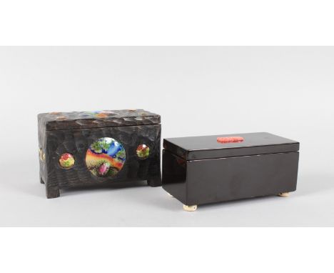 A BLACK LACQUER BOX with coral motif and a wooden box with enamel plaques (2).