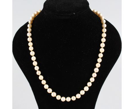 A SMALL STRING OF PEARLS with 18ct yellow gold and seed pearl set clasp.