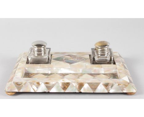 A MOTHER-OF-PEARL INKSTAND.  9ins long.