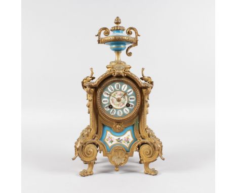 A 19TH CENTURY FRENCH ORMOLU AND SEVRES PANEL CLOCK with eight-day movement, striking on a single bell with urn finial and Se