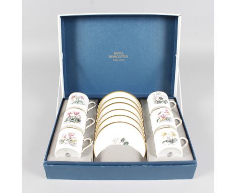 A ROYAL WORCESTER BOTANICAL PORCELAIN SET, six coffee cans and saucers, in original box.