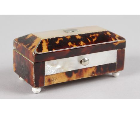 A MINIATURE TORTOISESHELL AND MOTHER-OF-PEARL CASKET on bun feet. 2.75ins long.