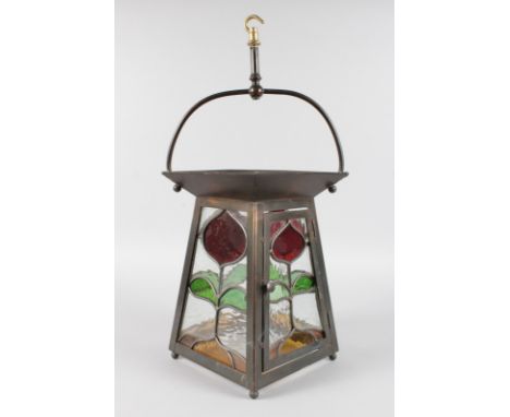 AN OXIDISED BRASS AND LEADED LANTERN.