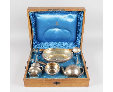 A RUSSIAN SILVER TEA SET, OVAL BASKET, sifter spoon, sugar tongs and fork by KHLEBNIKOV, in original wooden box, Circa. 1880'