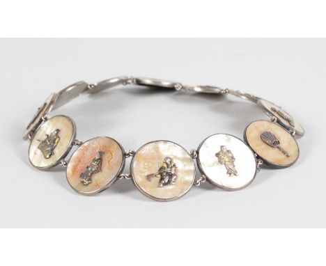 A CHINESE SILVER BRACELET, set with twelve circular mother-of-pearl plaques.