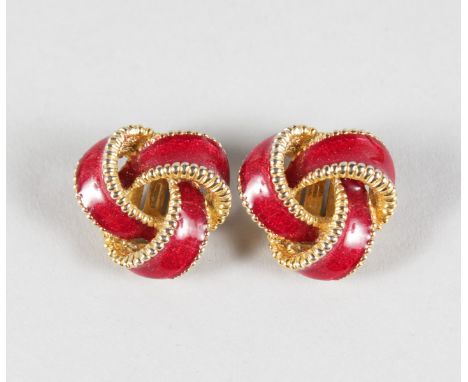A PAIR OF RED ENAMEL AND GILT CROSSOVER EAR CLIPS.