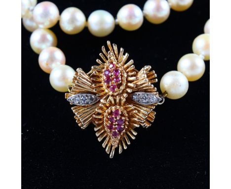 A SINGLE STRING OF PEARLS with 18ct yellow gold, ruby and diamond set clasp.