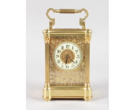 A GOOD 19TH CENTURY FRENCH BRASS CARRIAGE CLOCK with reeded column sides and filigree face. 6.25ins high.
