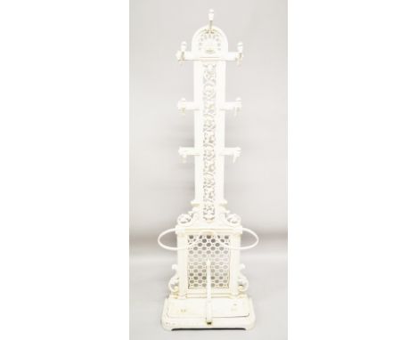 A VICTORIAN WHITE PAINTED CAST IRON COAT AND STICK STAND with pierced back, seven coat hooks and two with four sticks. 5ft 10