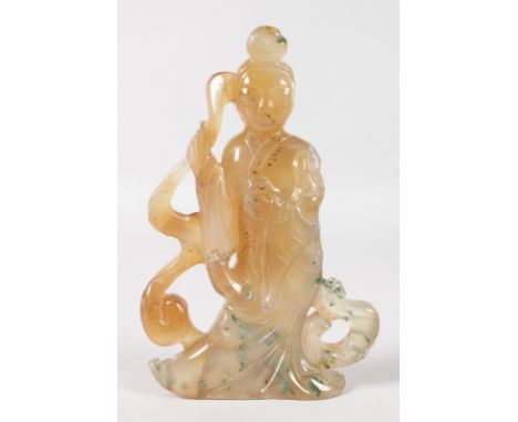A CARVED JADE FIGURE OF GUANYIN. 4.5ins high.
